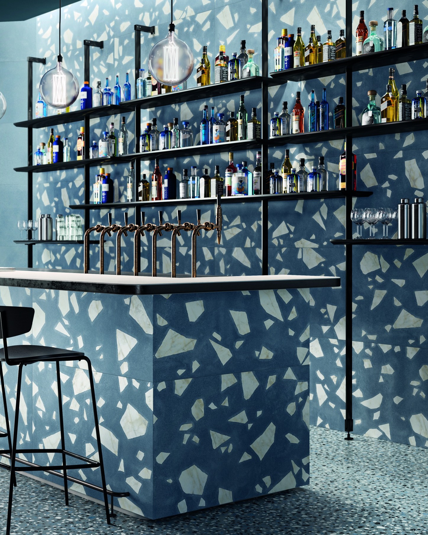 A closer look at Flintstone Bedrock Blue in Matt R10 a full commercial application.
The large-format tiles create uninterrupted surfaces across the bar front and walls, while the oversized terrazzo fragments add depth without visual clutter.
The R10 matte finish offers slip resistance with a soft-touch feel — a smart choice for hospitality environments. Here, the cool blue base tone contrasts beautifully with warm brass fittings and minimalist black shelving, giving the space a contemporary, layered aesthetic.
Design tip: Use large-fragment terrazzo on vertical planes to create impact, and pair with finer-grain flooring to keep the composition grounded.
#tileinspiration #tiledesign #interiorfinishes #materialpalette #surfacedesign
#interiorarchitecture #commercialinteriors #hospitalitydesign
#designspecification #archdaily #designerinteriors
#interiorinspo #moderndesign #architecturaldetail
#architile #terrrazzo