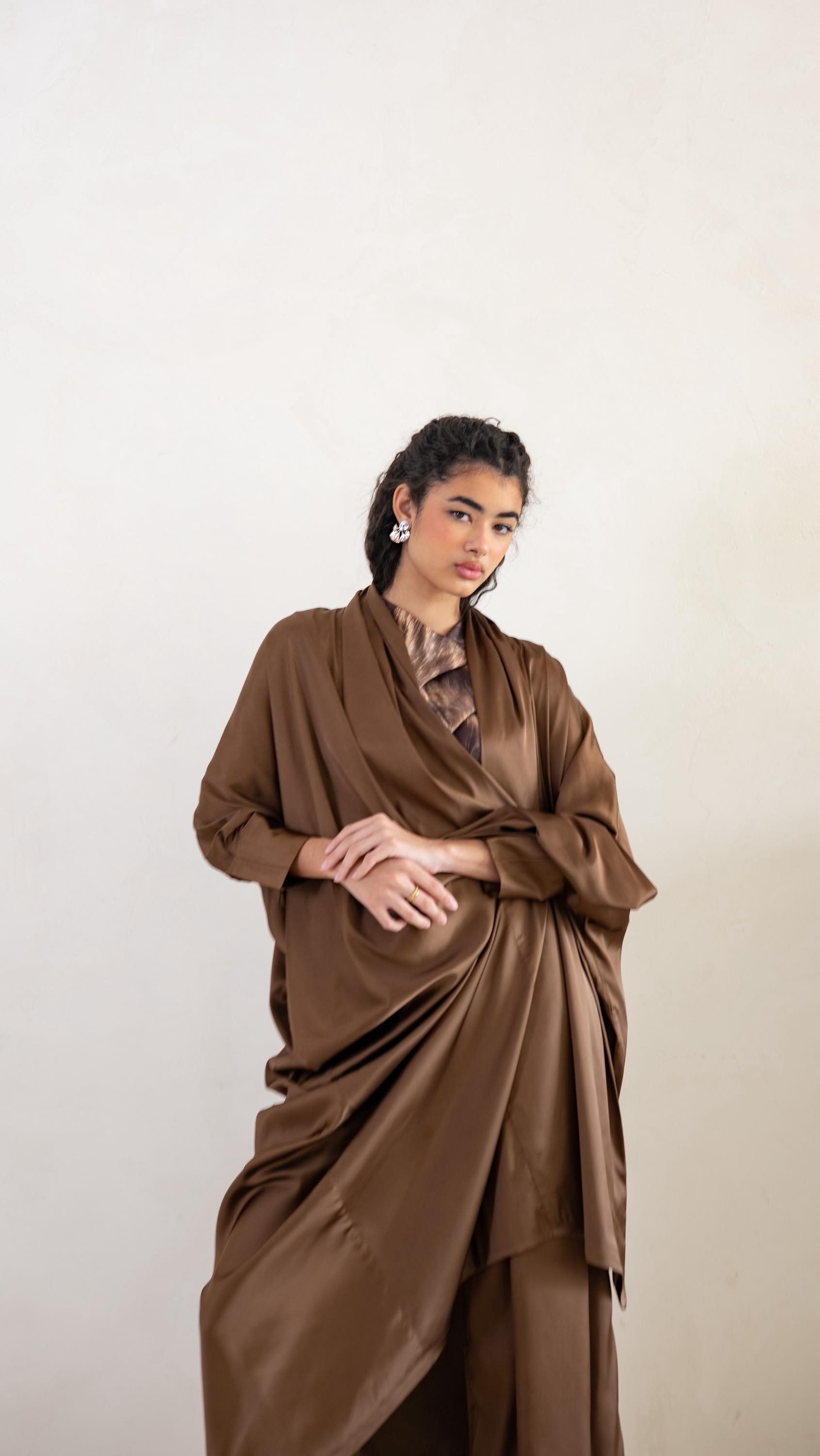 The Flow Abaya glides with every step, designed with convertible draping that transforms from hood to shawl
Flow Abaya | AED 750