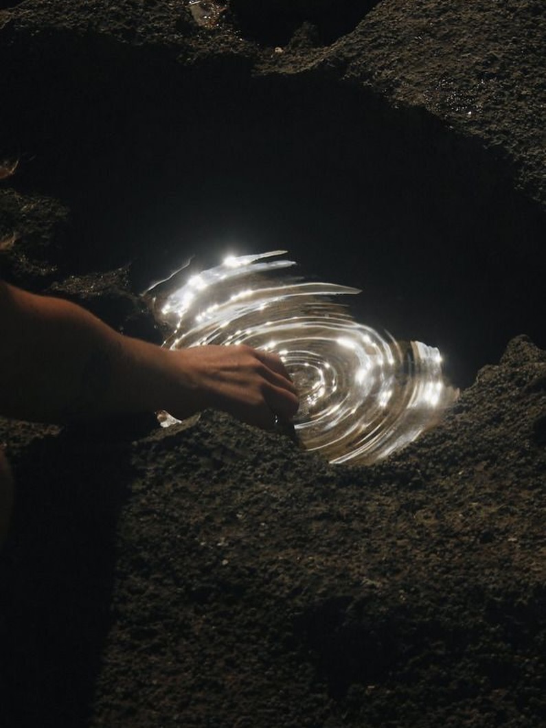 Where light dances on quiet ripples, tranquility whispers in soft reflection.