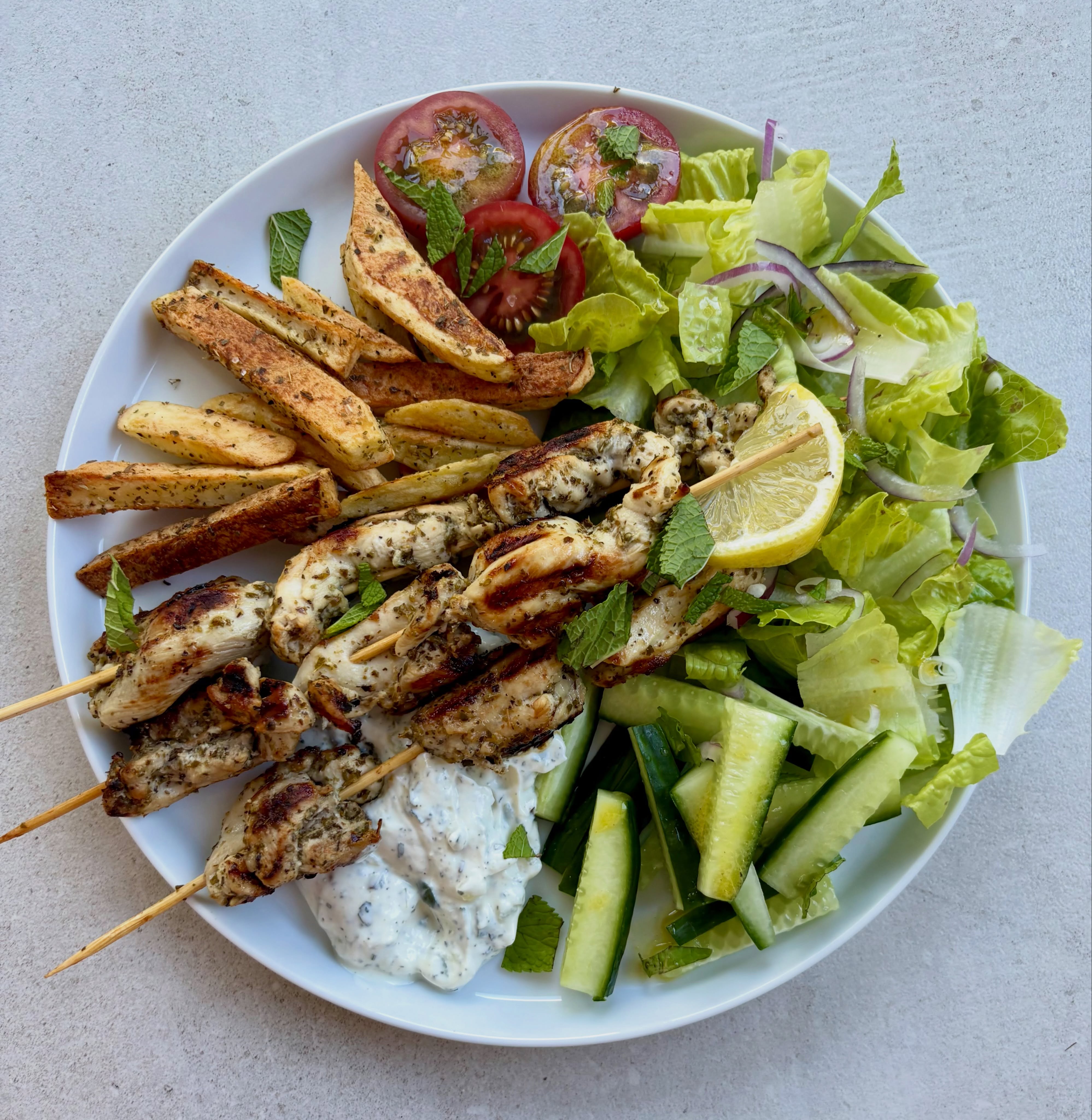 Chicken souvlaki is so easy to make, just a simple marinade of olive oil, lemon juice, oregano and garlic. I used chicken thighs although sometimes use breast. Delicious with some homemade Greek fries, tzatziki and salad. Making the most of cooking before it gets too hot!
Recipes on my website.
#greekfood #souvlaki #greekfries